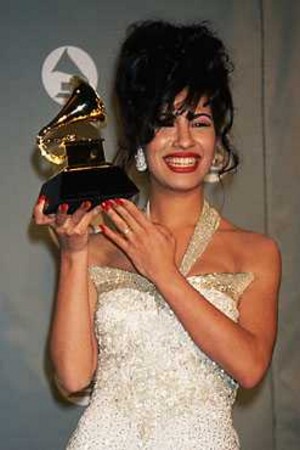 Selena holds a Grammy Award.