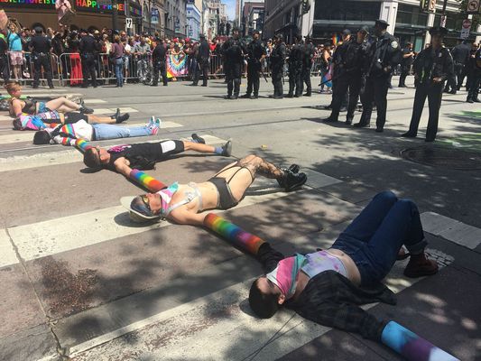 Demonstrators block the annual LGBTQ pride parade in San Francisco on Sunday, June 30, 2019. About a dozen protesters chained together blocked the parade for an hour and then left after police declined to arrest them.