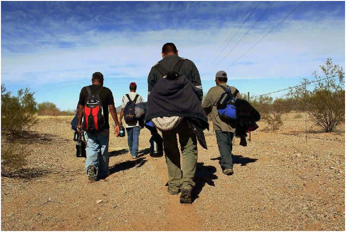 Undocumented Mexican immigrants crossing the Sonoran desert on their way to work in Tucson, Arizona, January 2011.