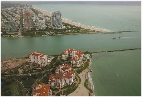 The coastline of Miami Beach andpart of Fisher Island (bottom) are seen June 3, 2014, in Florida. According to numerous scientists, south Florida could be flooded by the end of the century as global warming continues to melt the Arctic ice, in turn causing oceans to rise. U.S. President Barack Obama and the U.S. Environmental Protection Agency announced in August 2015 a rule that would reduce the nation's biggest source of pollution, carbon emissions from power plants, 30 percent by 2030 compared to 2005 levels. It is widely believed that these emissions are a main cause ofglobal warming.