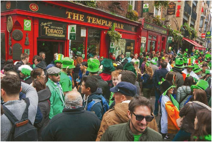 A crowd gathers at Temple Bar to celebrate St. Patrick's Day in Dublin, Ireland.
