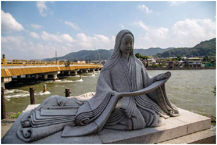 This statute depicts Murasaki Shikibu, the author of The Tale of Genji, a landmark eleventhcentury Japanese novel about spiritual and romantic possession.