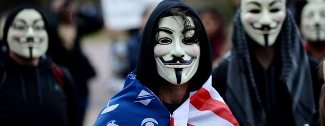 Anonymous and Pro-democracy protesters wearing Guy Fawkes masks walk in front of the White House for the Million Mask March, Nov. 5, 2014 in Washington, DC. Demonstrators protest against austerity, mass surveillance and oppression.