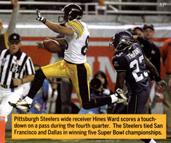 Pittsburgh Steelers running back Jerome Bettis, right, holds the Lombardi  Trophy as MVP receiver Hines Ward raises his fist after the Pittsburgh  Steelers defeated the Seattle Seahawks 21 to 10 in Super