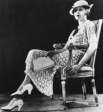 The dominant look for womens everyday wear in the 1930s was the simple print dress made of synthetic material, a striking difference from the natural fabrics of the 1920s silhouettes.  UPI/Corbis- Bettmann.