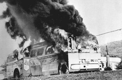 A Freedom Rider bus burns after someone from an angry mob of segregationists tossed a firebomb through one of its windows. Members of that mob beat the civil rights activists who were onboard as they evacuated the bus through an emergency exit.
