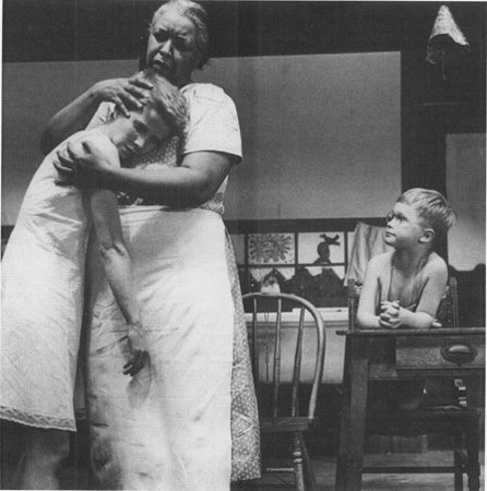 Despite the racial barrier that exists between them, Frankie (Julie Harris) is still able to take comfort from Berenice (Ethel Waters) as John Henry (Brandon de Wilde) looks on