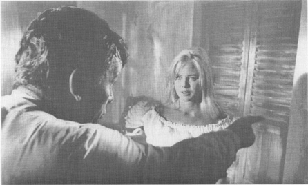 A scene from the film: Shannon (Burton) orders Charlotte (Sue Lyons) out of his room