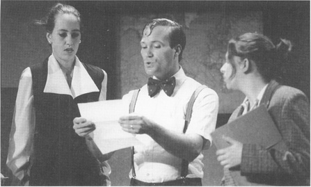 A scene from the 1996 University of Kansas Theatre production of The, Memorandum, featuring (from left to right) Jennette Selig as Jan Ballas, Jefferson R. Bachura as Otto Stroll, and Jamie Johnson as Helena.