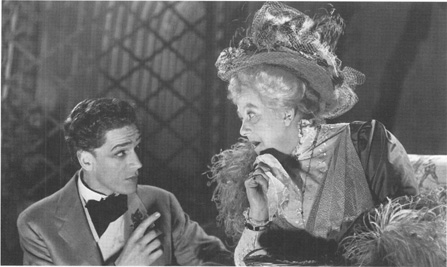 Margaret Rutherford, as Madame Desmermortes, talking to Paul Schofield, as Hugo, in a 1950 production of Ring around the Moon.