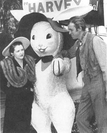 Playwright Mary Coyle Chase and actor James Stewart pose with the giant rabbit featured in the 1950 film adaptation of Harvey.