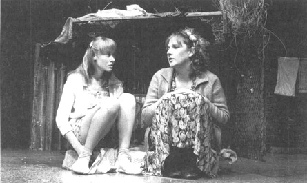Beth Goddard as Kit and Lesley Sharp as Angie in a scene from a theatrical production of Top Girls.