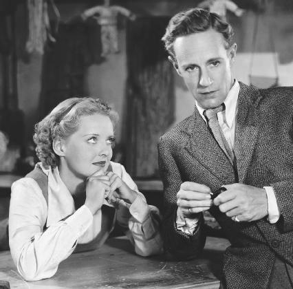 A scene from the 1936 film adaptation of The Petrified Forest, featuring Bette Davis and Leslie Howard