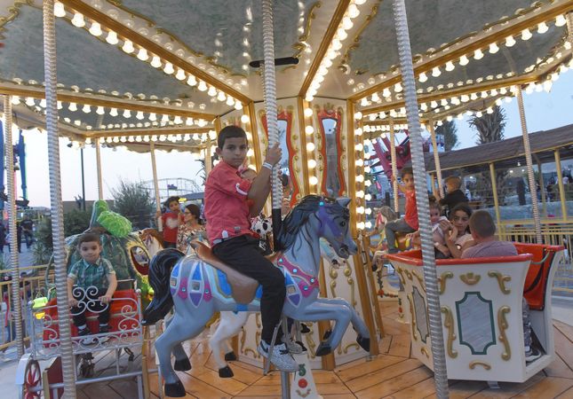 A Palestinian Boy Rides A Merry Go Round In Jericho Document Gale Onefile Health And Medicine