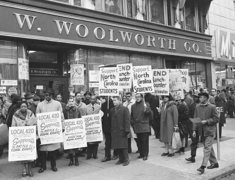 CORE-sponsored protest. Demonstrators picket outside a Woolworth store in Harlem, protesting discrimination practices at Woolworths lunch counters there and in Greensboro, Charlotte, and Durham, North Carolina.  BETTMANN/CORBIS. REPRODUCED BY P