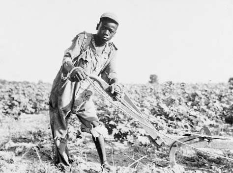 A thirteen-year-old sharecropper plows a field near Americus, Georgia, 1937. The Great Depression intensified the severe poverty of many rural farmers. THE LIBRARY OF CONGRESS