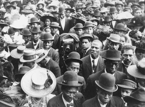 A large and well-dressed crowd of travelers, mostly African Americans, c. 1910. Of the period known as the Great Migration, James Weldon Johnson wrote: Migrants came north in thousands, tens of thousands, hundreds of thousandsfrom the docks of 