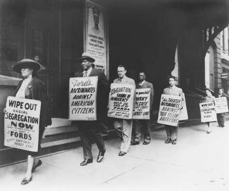 Paul Robeson joins NAACP picket line, Baltimore, Maryland. Acclaimed actor and singer Robeson participates in an NAACP protest in front of Fords Theatre, objecting to the theatres policy of racial segregation. Pictured (left to right) are: Ada 