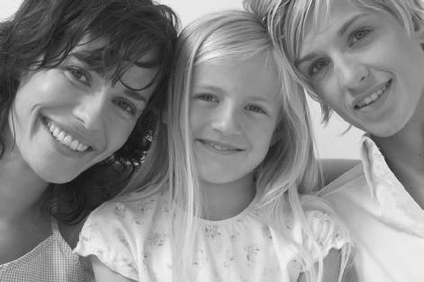 Lesbian Family. A lesbian couple with their daughter.
