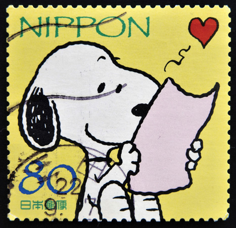 A Japanese postage stamp featuring Snoopy, the