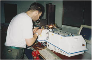 A scientist prepares to test the Dobson Spectrophotometer, a device used to measure ozone levels.
