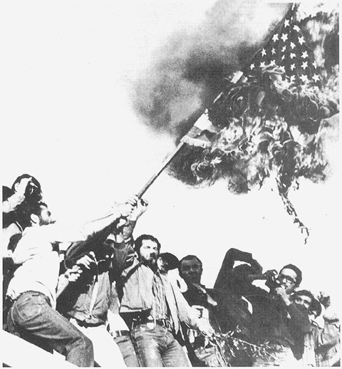 Iranian protestors burning the American flag in Teheran, 1979