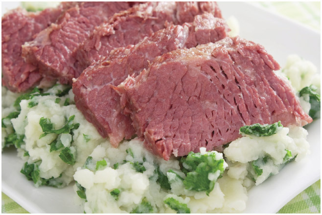 Shown here are two Irish staples: corned beef served over colcannon (potatoes and cabbage).