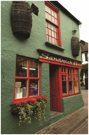 In Ireland, there are many different types of eating establishments, from fine restaurants to Irish pubs to street food stalls. Here, a sandwich bar in Kinsale, County Cork, is shown.
