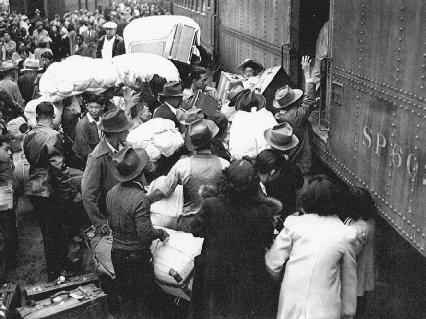 Japanese Americans boarding trains for the Manzanar Relocation Center