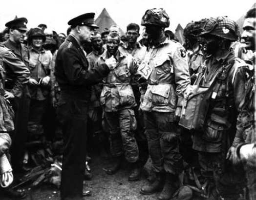 General Dwight D. Eisenhower gives the Order of the Day to paratroopers in England just before they board their airplanes to participate in the D-Day invasion of June 6, 1944.