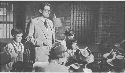 From the film To Kill a Mockingbird, starring Gregory Peck, Mary Badham, Phillip Alford, and John Megna, 1962.