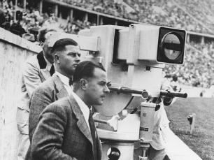 A German camera crew captures the action at the 1936 Summer Olympics in Berlin, Germany. The Olympics were not broadcast in the United States until 1960.