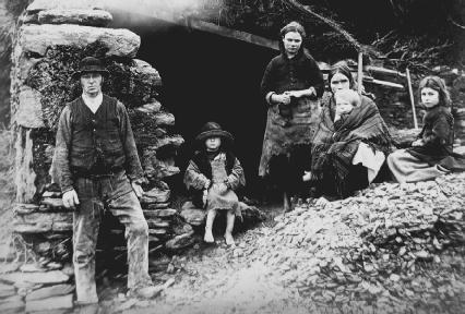 An Irish family, evicted from their home in Glenbeigh, Ireland, in 1888. Reproduced by permission of © Sean Sexton/Corbis.