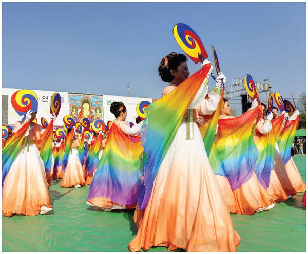 Many Buddhist festivals occur around the world each year. Here, actresses perform at a Buddhist Cheer Rally in conjunction with the Lotus Lantern Festival in Seoul, South Korea, in 2013.