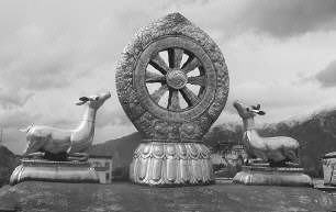 The dharmachakra is a sacred symbol representing the Buddhas first teachings after enlightenment, The eight spokes of the wheel stand for each step on the Eightfold Path, The deer statues symbolize Deer Park, where the Buddha gave his first ser