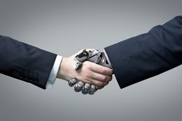 Businessman and robot's handshake